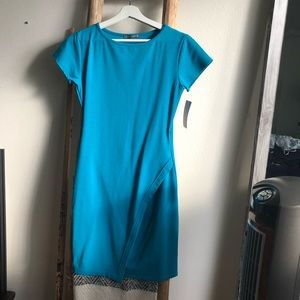 Teal blue dress with short sleeves. Never worn.